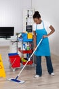 Female Worker Cleaning Floor In Office Royalty Free Stock Photo