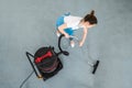 Female Janitor Cleaning Floor With Vacuum Cleaner Royalty Free Stock Photo