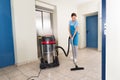 Female Janitor Cleaning Floor