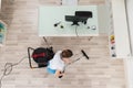 Female Janitor Cleaning Wooden Floor With Vacuum Cleaner Royalty Free Stock Photo