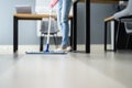 Female Janitor Mopping Floor Royalty Free Stock Photo