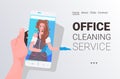 Female janitor woman cleaner on smartphone screen self isolation office cleaning service concept Royalty Free Stock Photo