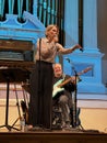 female jazz folk singer with guitarist, main stage Mechanics Hall worcester ma (Evening sky jazz band Royalty Free Stock Photo