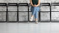 Female job applicant sitting on chair in corridor, cropped view