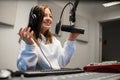 Female Jockey Communicating On Microphone In Radio Studio Royalty Free Stock Photo