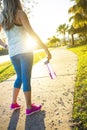 Female jogger in a city park view from behind Royalty Free Stock Photo