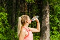 Female jogger quenches thirst