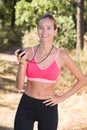 female jogger ready to run looking at stopwatch Royalty Free Stock Photo