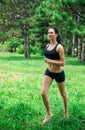 Female jogging outside in the park. Runners training outdoors