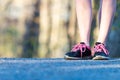 Female jogging sport shoes close-up on running trail. Royalty Free Stock Photo