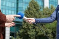 Female journalist conducting an interview with businessman or politician Royalty Free Stock Photo