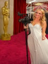 A journalist on the red carpet at the Academy Awards curtain Royalty Free Stock Photo