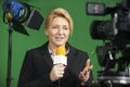 Female Journalist Presenting Report In Television Studio Royalty Free Stock Photo