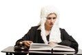 Female judge wearing a wig and black mantle with judge gavel an Royalty Free Stock Photo