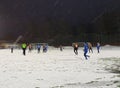 Female junior football match in winter on snow covered field - Helsinki, Finland Royalty Free Stock Photo