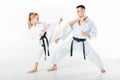 female karate fighter kicking male partner