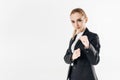 female karate fighter standing in suit and showing fists
