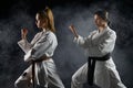 Female karatekas, training in white kimono Royalty Free Stock Photo