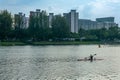 A female kayaker is kayaking leisurely at Kallang Basin, Singapore.