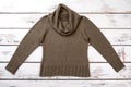 Female khaki color warm sweater.