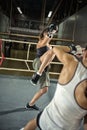 Female kick boxer practicing attack