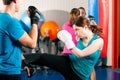 Female kick boxer with trainer in sparring Royalty Free Stock Photo