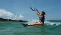 Female Kite surfer riding a kiteboard on the sea