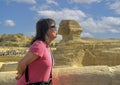 Female Korean tourist and The Great Sphinx of Giza, on the Giza Plateau in Giza, Egypt.