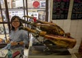 Female Korean tourist in a historic tapas restaurant, La Pineda Fiabres, established in 1930 in Barcelona, Spain.