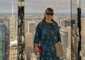 Female Korean tourist posing in the immersive art experience of SUMMIT One Vanderbilt in New York City. Royalty Free Stock Photo