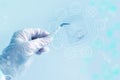 Female lab hand holds a hair sample with tweezers for dna test on a virtual display background, scientific concept