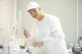 Female lab worker doing tests in a laboratory in an industrial c Royalty Free Stock Photo