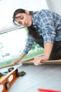 Female labor fitting wooden floor
