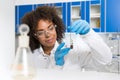 Female Laboratory Scientist Examining Plant Sample In Test Tube, Work In Genetics Lab Royalty Free Stock Photo