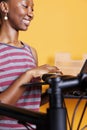 Female with laptop for bike maintenance