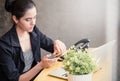 Female laptop cell phone finger table desk Royalty Free Stock Photo