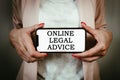 Female lawyer holding phone with text online legal advice. Compliance, expertise, consulation, help concept Royalty Free Stock Photo