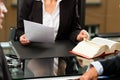 Female Lawyer or notary in her office