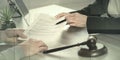 Female lawyer showing a document to her client, geometric pattern