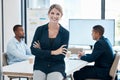 Female leader, manager or CEO with a business woman in a meeting for planning or strategy and her team in the background Royalty Free Stock Photo