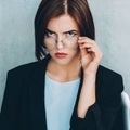 Female leader skeptic business woman eyeglasses Royalty Free Stock Photo