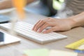 Female left-hand typing on bluetooth keyboard Royalty Free Stock Photo