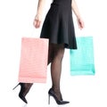 Female legs in black high heels shoes bags package black skirt fashion Royalty Free Stock Photo