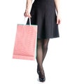 Female legs in black high heels shoes bags package black skirt fashion Royalty Free Stock Photo