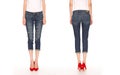 Female legs in blue breeches and red shoes Royalty Free Stock Photo