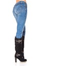 Female legs in a blue jeans and high boots Royalty Free Stock Photo