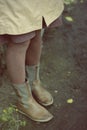 Female legs in boots, brown tights. Autumn mood