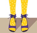 Legs in yellow tights on a white background