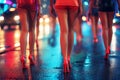 female legs of crowd of prostitute girls in miniskirts and high heels at night