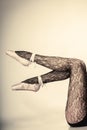 Female legs dancer in ballet shoes